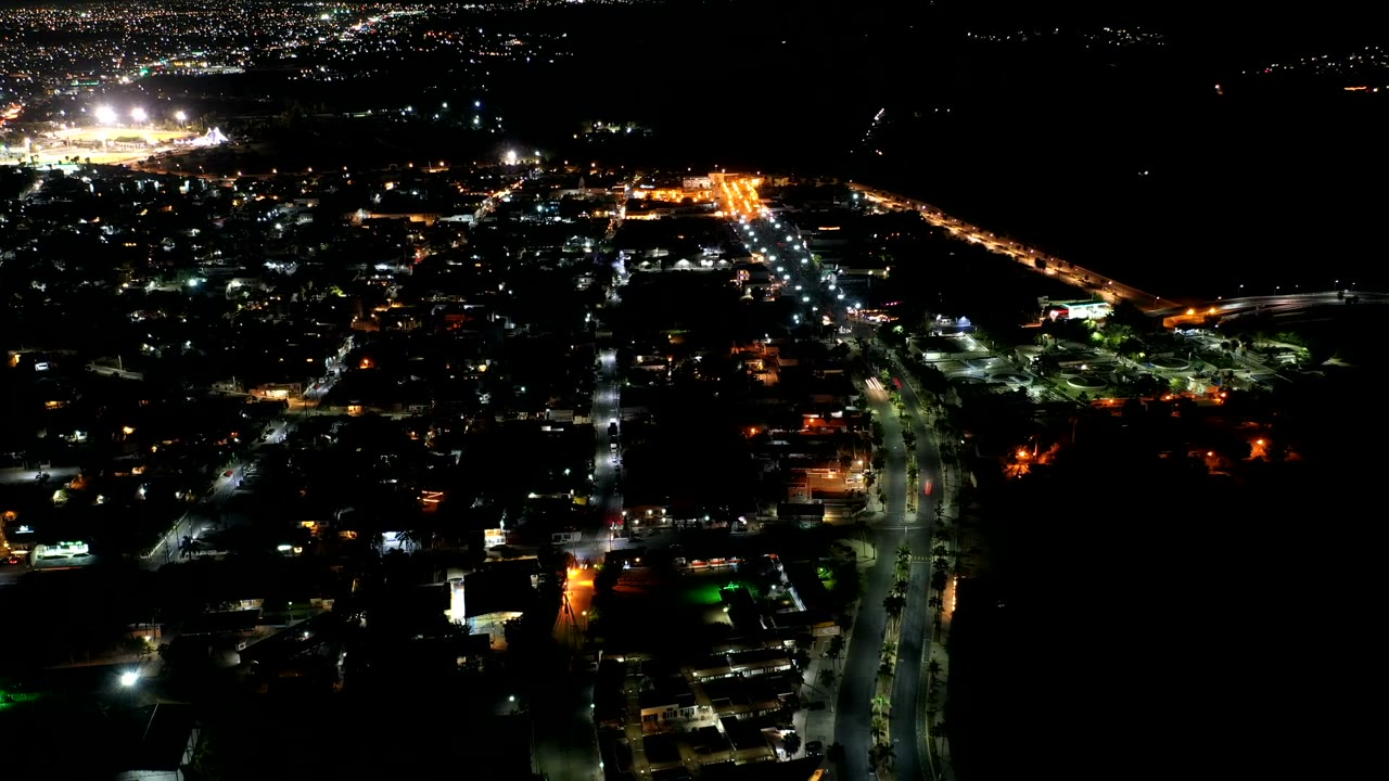 Night aerial view of city streets and lights