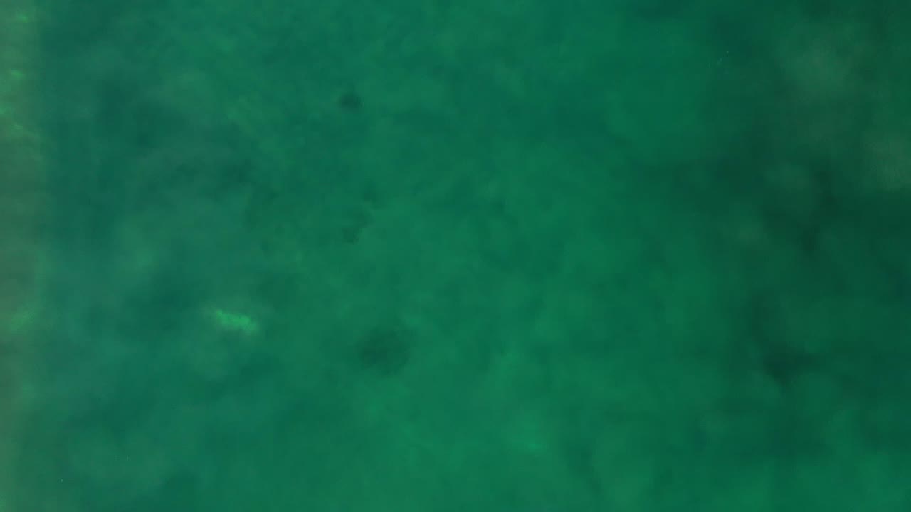Second frame shows a top-down Los Cabos water surface with broad green tones, faint darker patches, and no visible people or shoreline.
