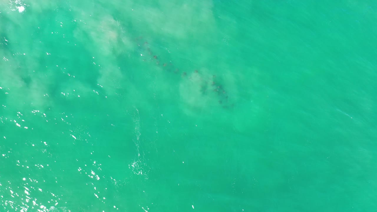 Turquoise water with ripples and submerged sand