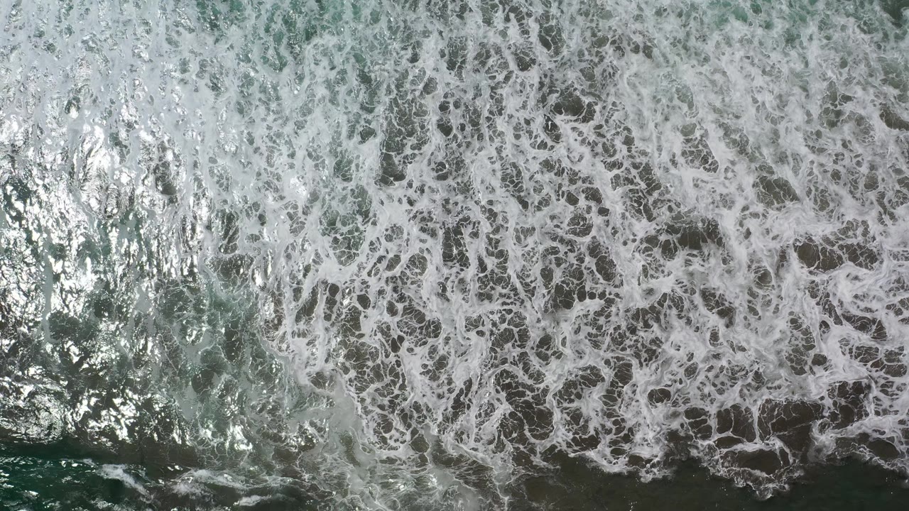 Top-down surf foam and darker water channels