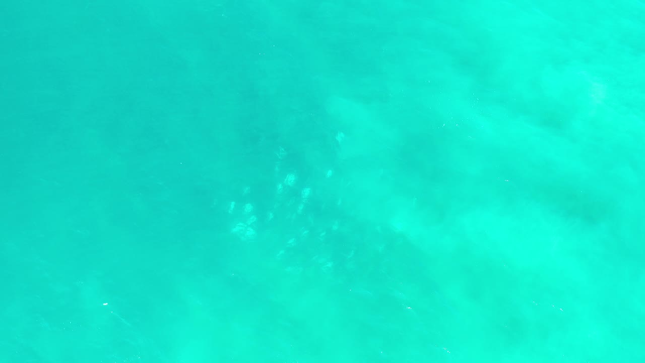 Turquoise ocean water with faint surface ripples