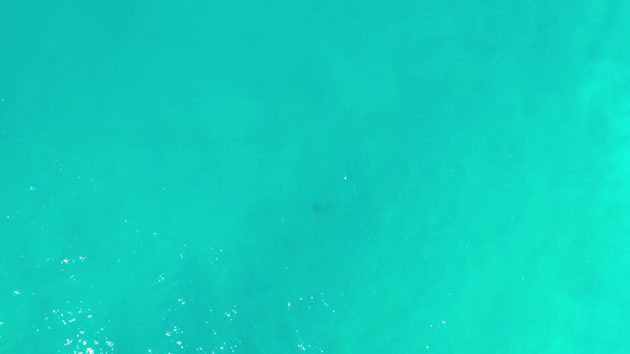 Turquoise-green water seen from above