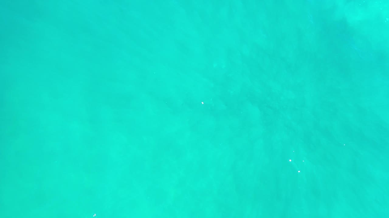Turquoise water with soft ripple texture.