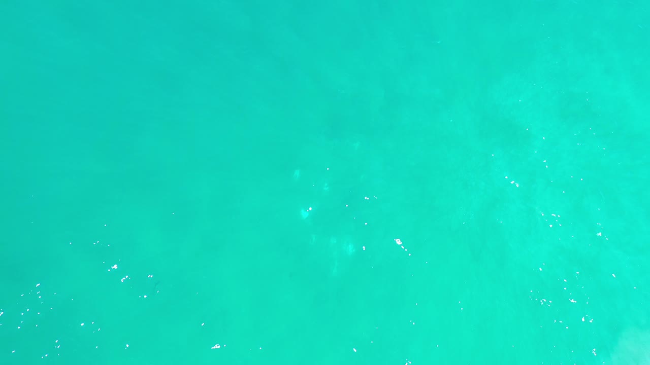 Turquoise ocean surface from above