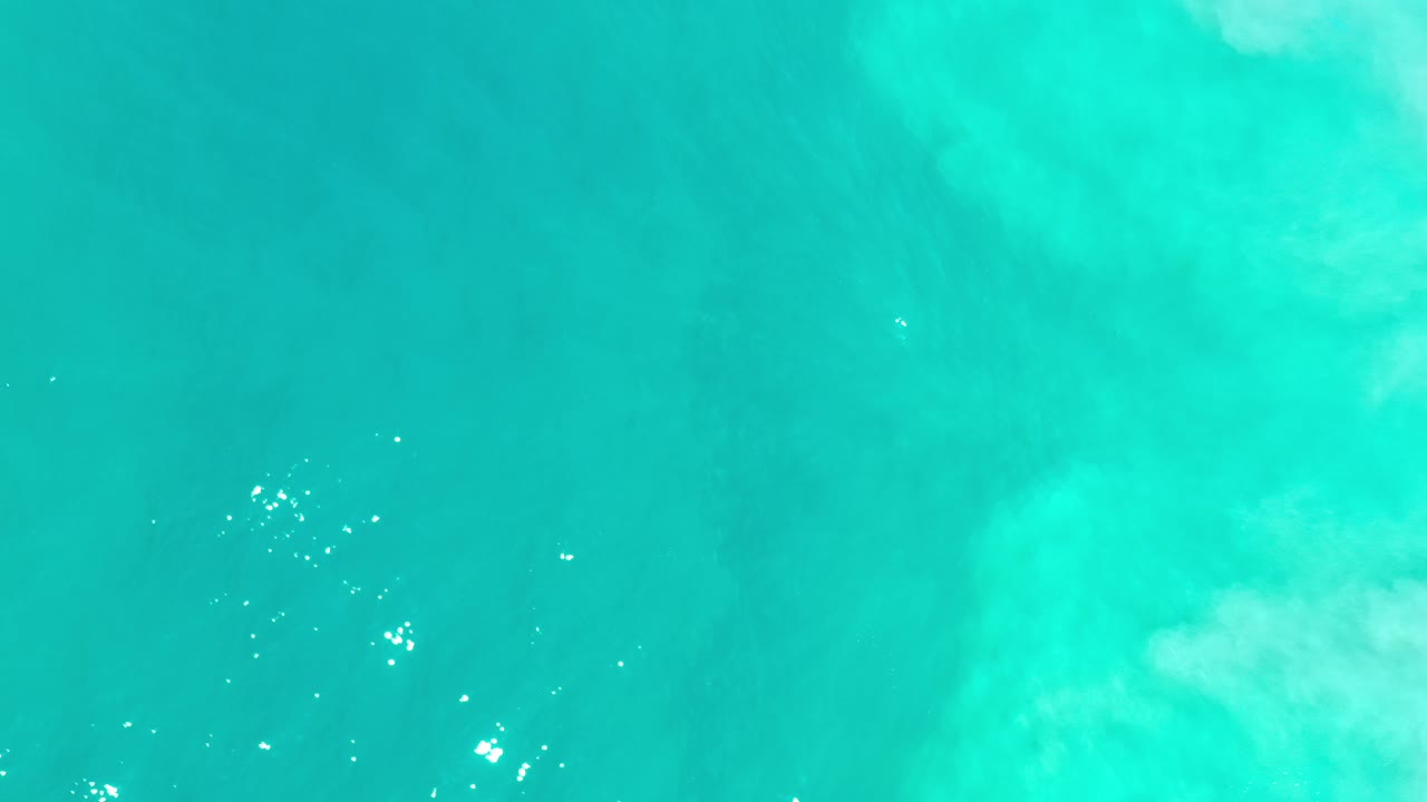 Turquoise ocean water filling the frame