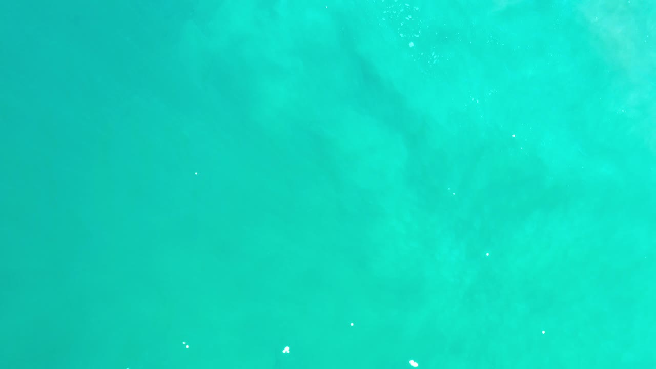 Turquoise green sea surface filling the frame