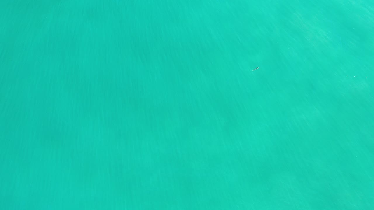 Overhead turquoise sea water with faint underwater texture