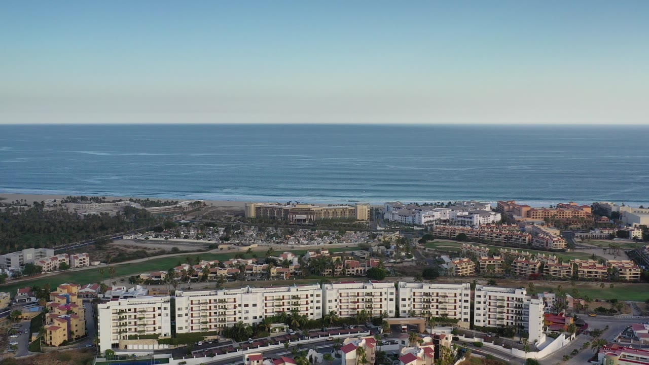 Aerial view of coastal buildings and ocean horizon
