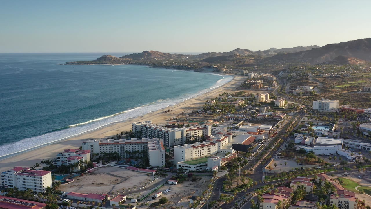 Beachfront hotels and shoreline seen from an elevated aerial angle.
