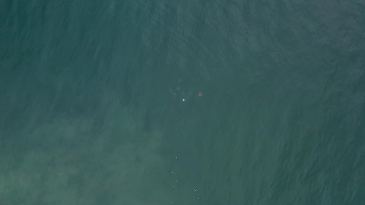 Overhead green water with faint cloudy shallows