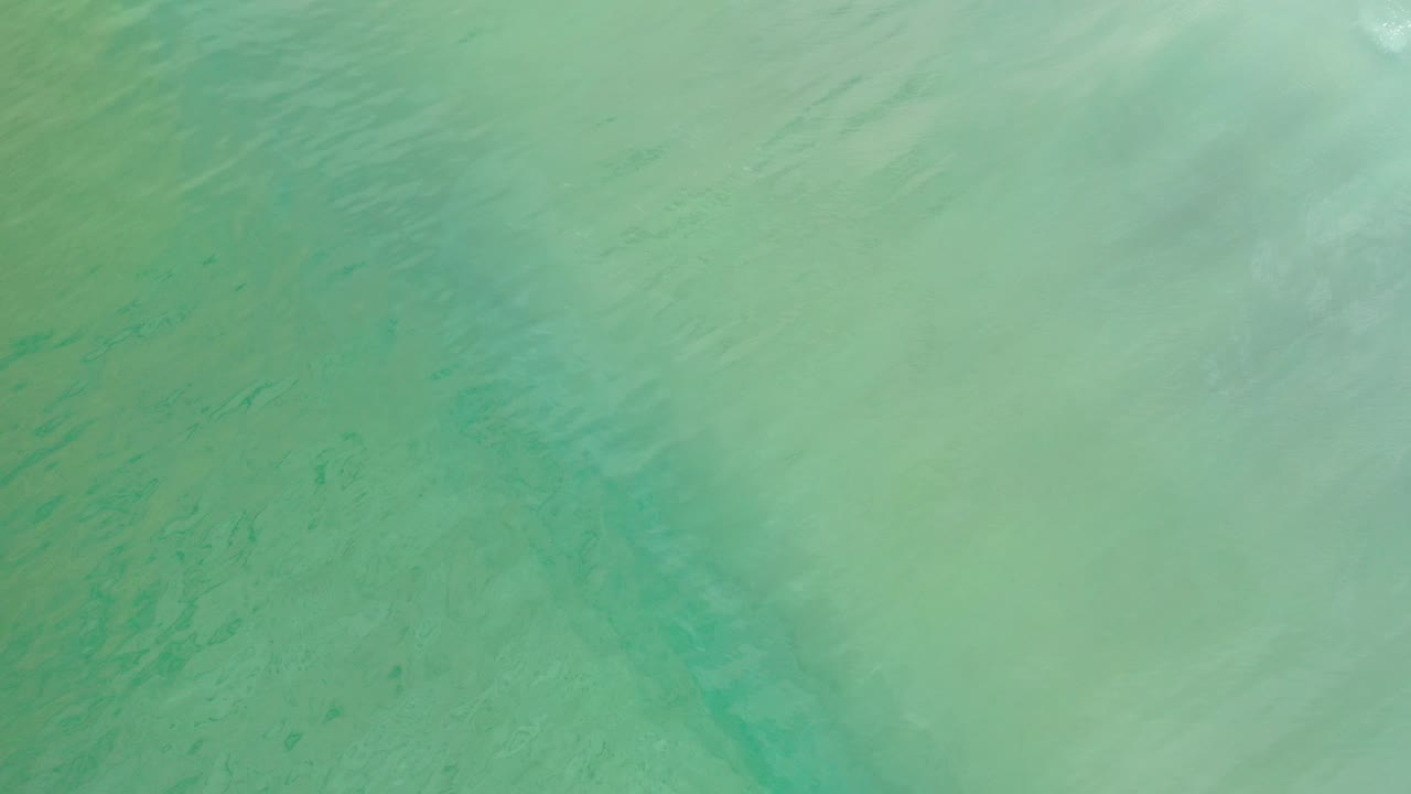Overhead turquoise water with faint surface reflections
