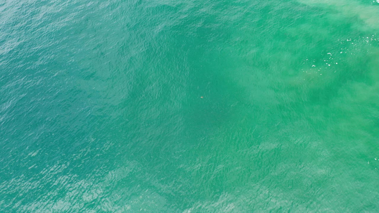 Overhead turquoise ocean water with soft ripples
