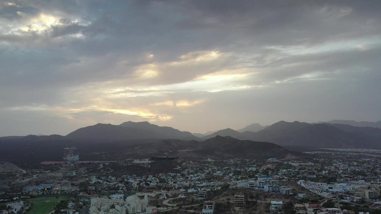 Cloudy sky over Los Cabos city and mountains