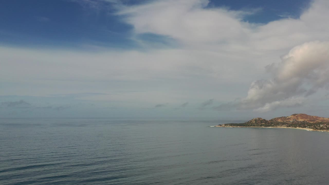 Wide sea view with island at the right edge
