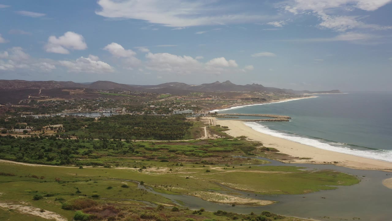 Los Cabos beach aerial with lagoon water and coastal development
