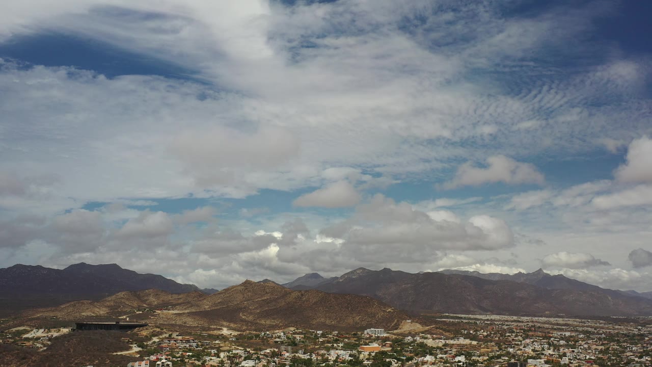 Mountain horizon under a cloudy sky