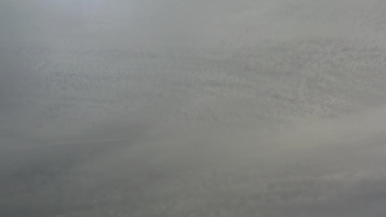 Blue-gray overcast sky with darker cloud bands.
