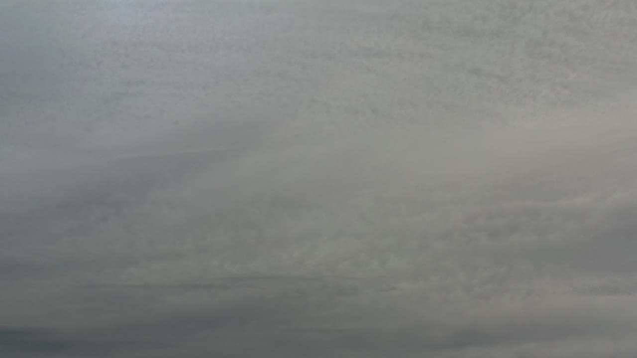 Flat overcast sky with darker cloud streaks.