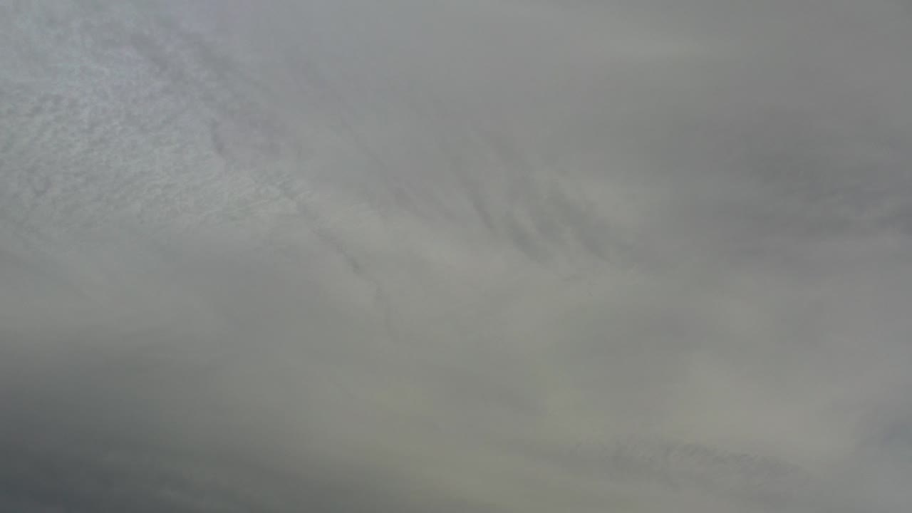 Gray-white cloud layers fill the frame.