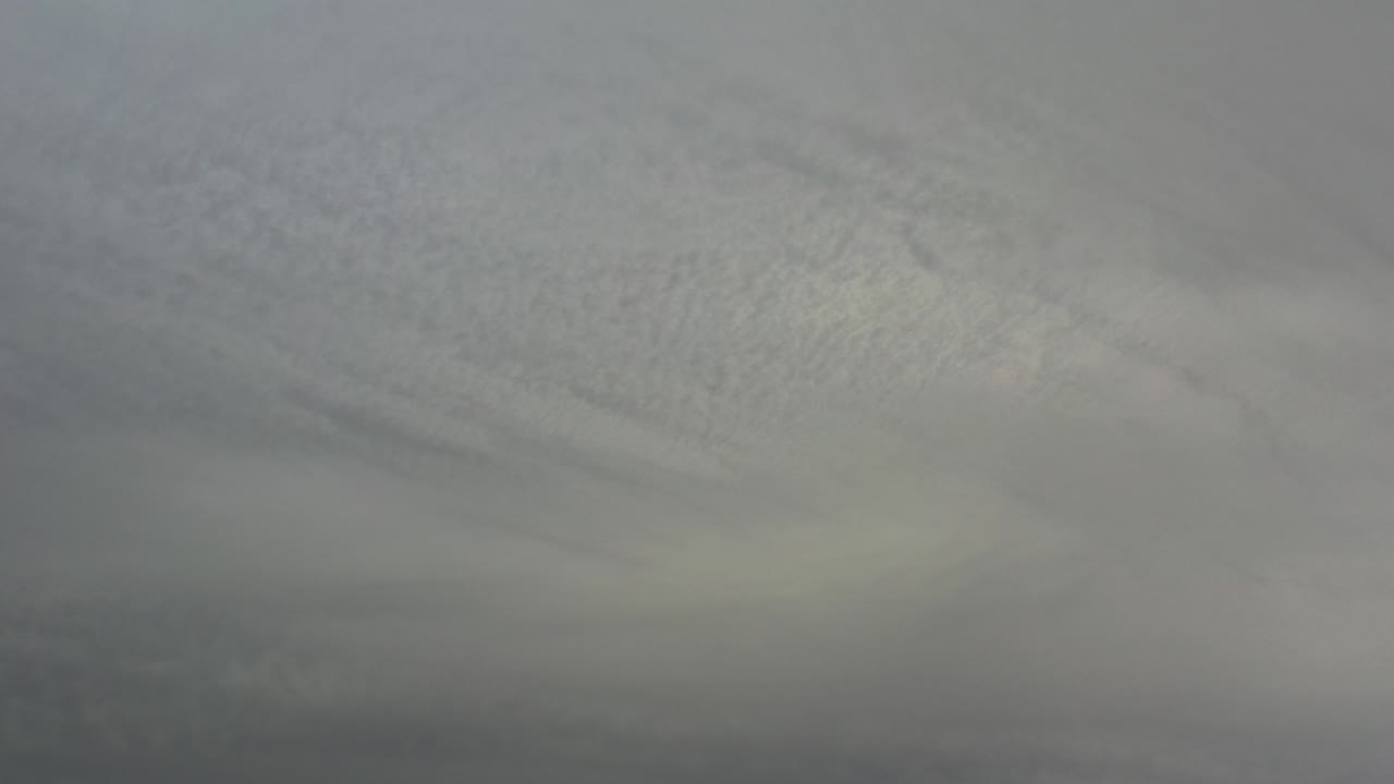 Gray wispy cloud cover fills the frame in Los Cabos, Mexico, with muted light and no visible people.