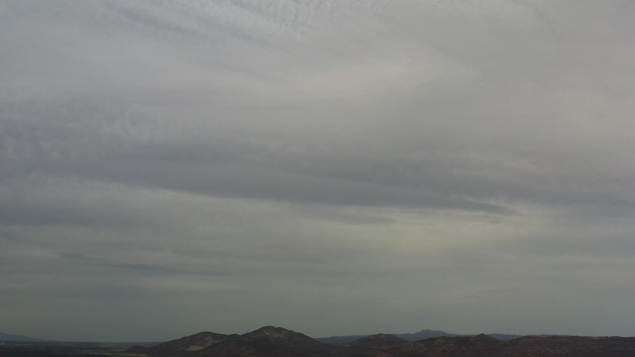 Overcast sky and rugged mountain horizon