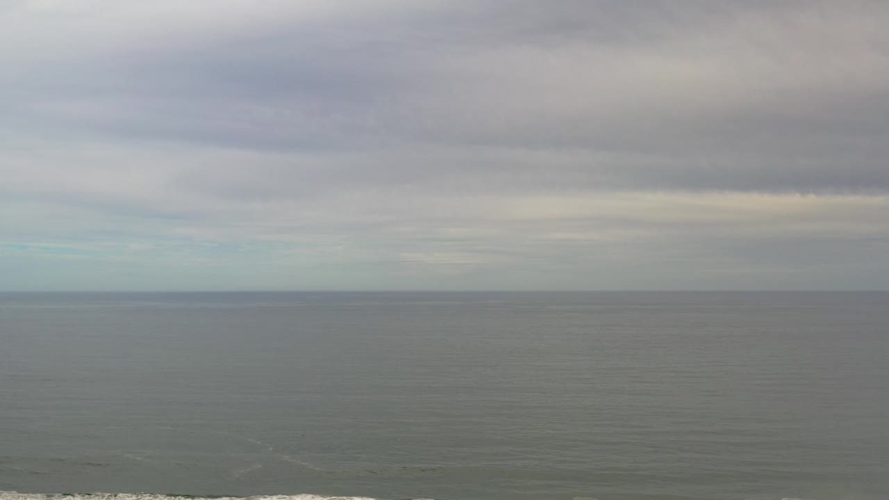 Cloudy ocean horizon with muted evening light