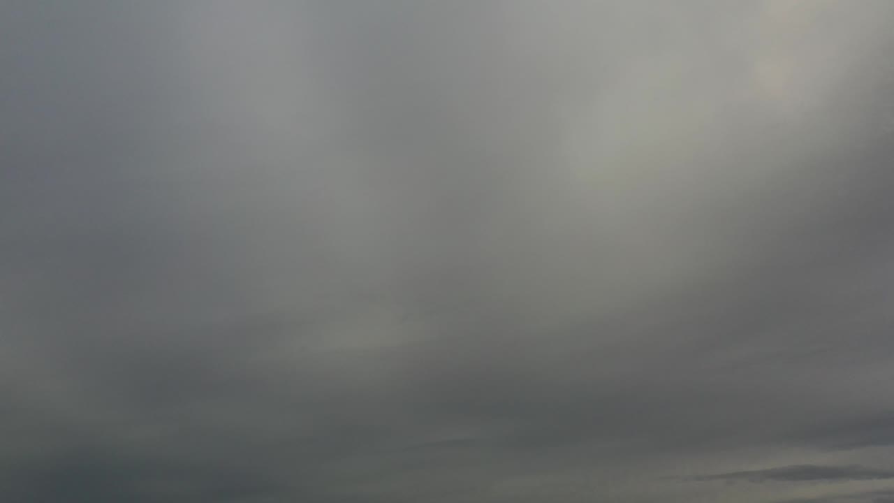 Dark cloud layer stretches across the lower sky.
