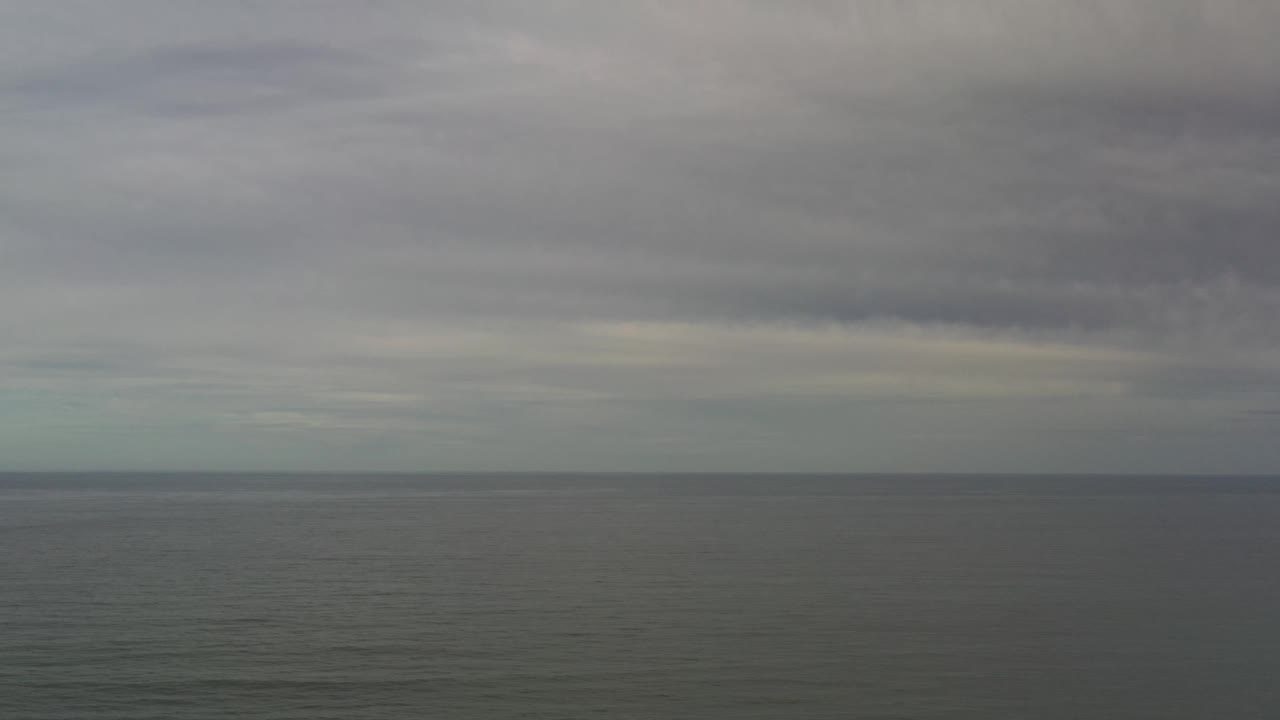 Los Cabos Mexico ocean view one second in, with the cloud deck hanging low over the horizon and no visible people.