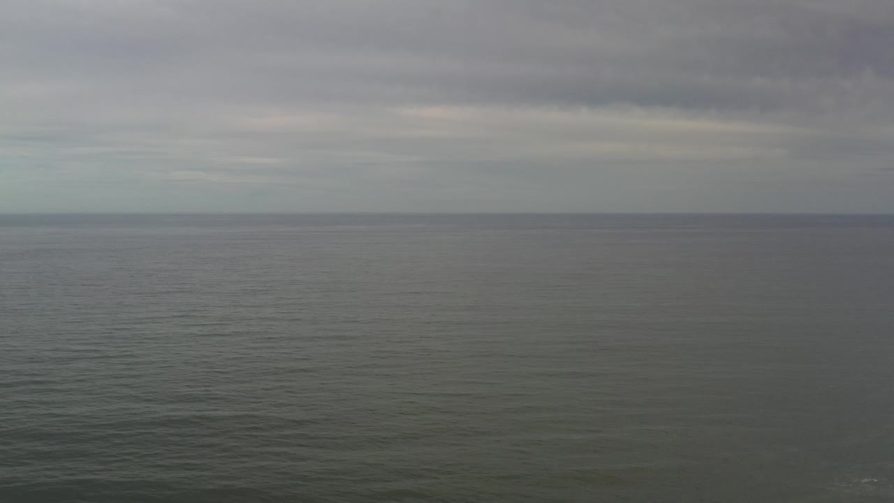 Calm sea surface with distant horizon
