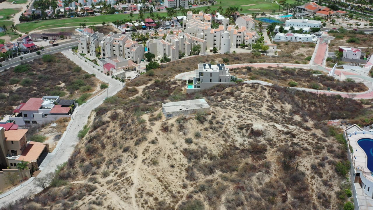 Aerial view of dry hillside roads and residential buildings