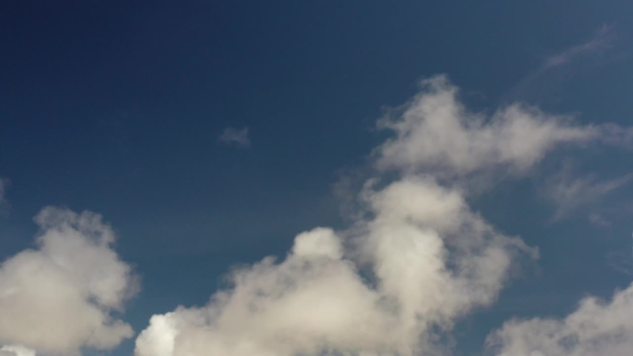 Cloud cluster spread across the lower sky.