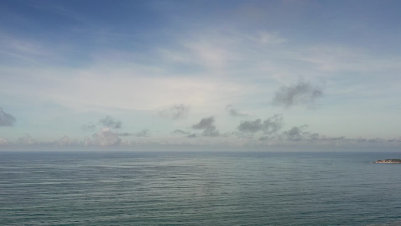 Opening frame of the Los Cabos ocean view, with rippled water below a pale blue sky and no visible people.