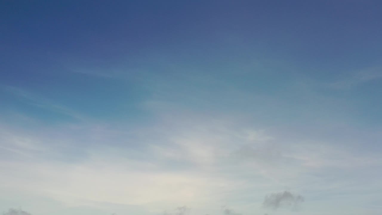 Blue sky with a brighter cloud band along the bottom.