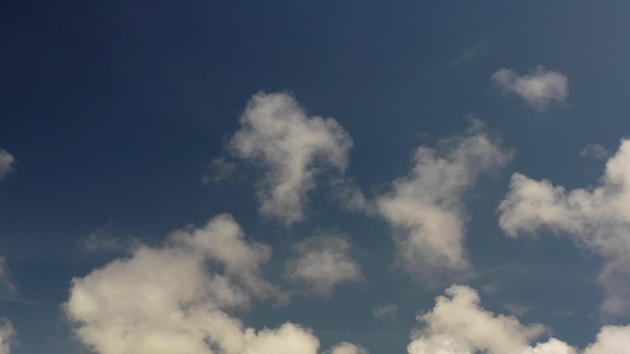 Cloud clusters on blue sky background