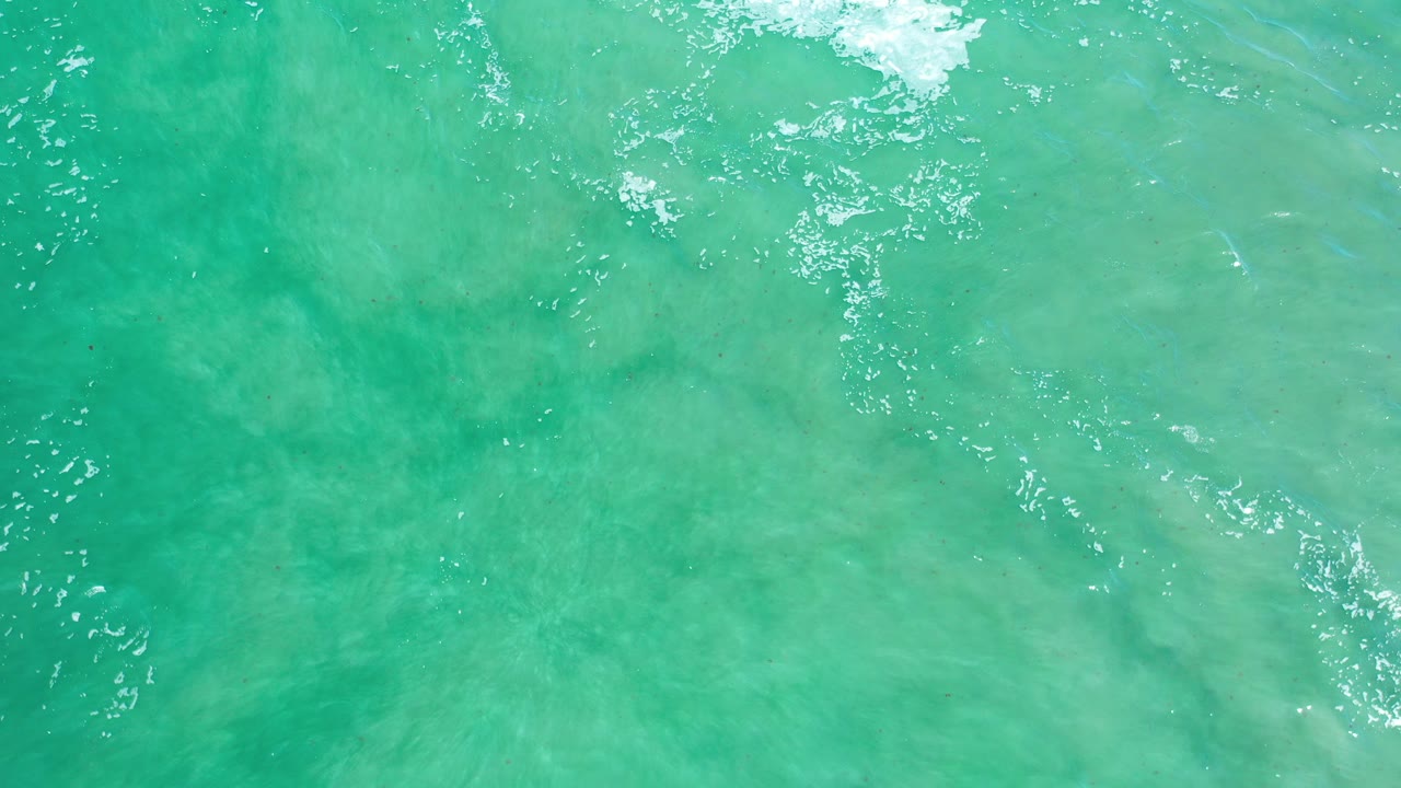 Turquoise ocean water seen from directly above.