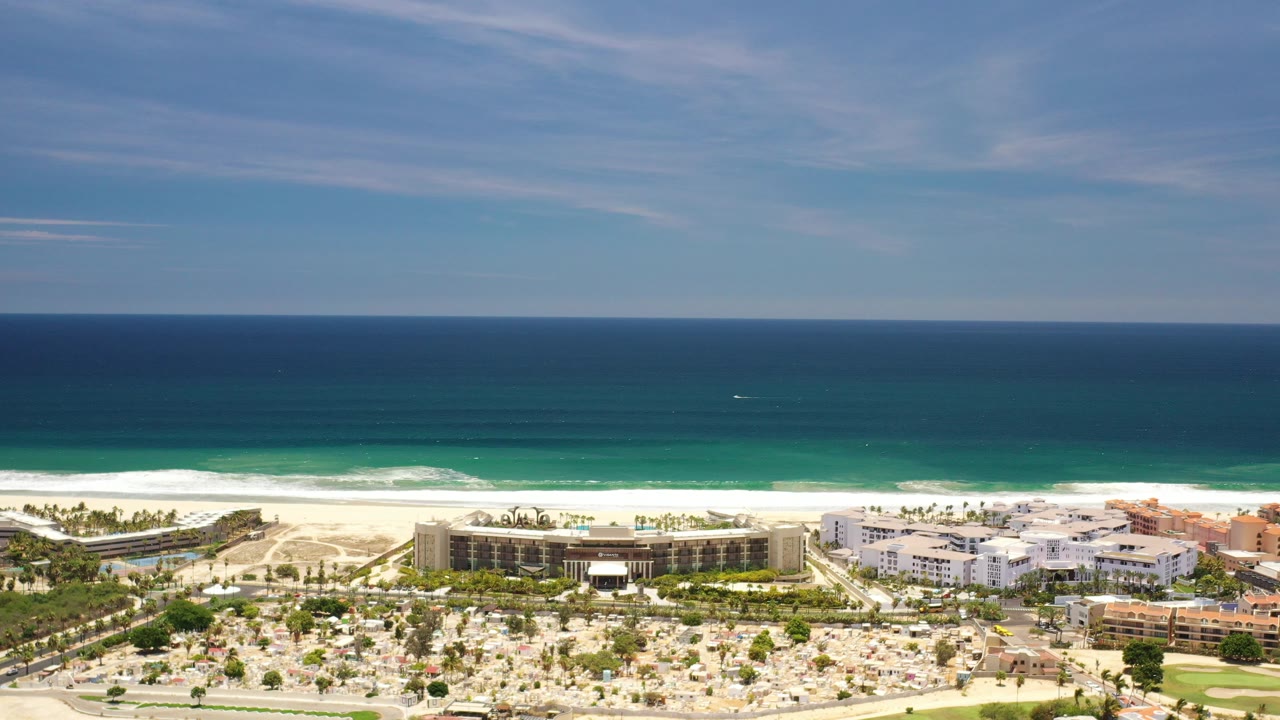 Aerial view of beachfront buildings and ocean horizon
