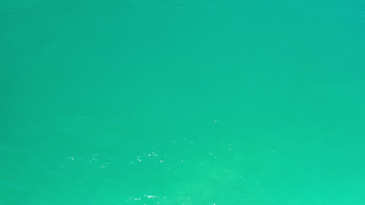 Turquoise ocean water with small surface highlights