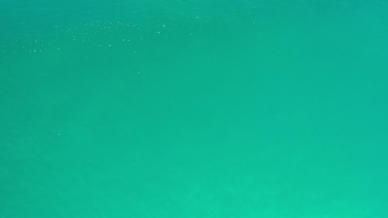 Turquoise ocean water filling the frame