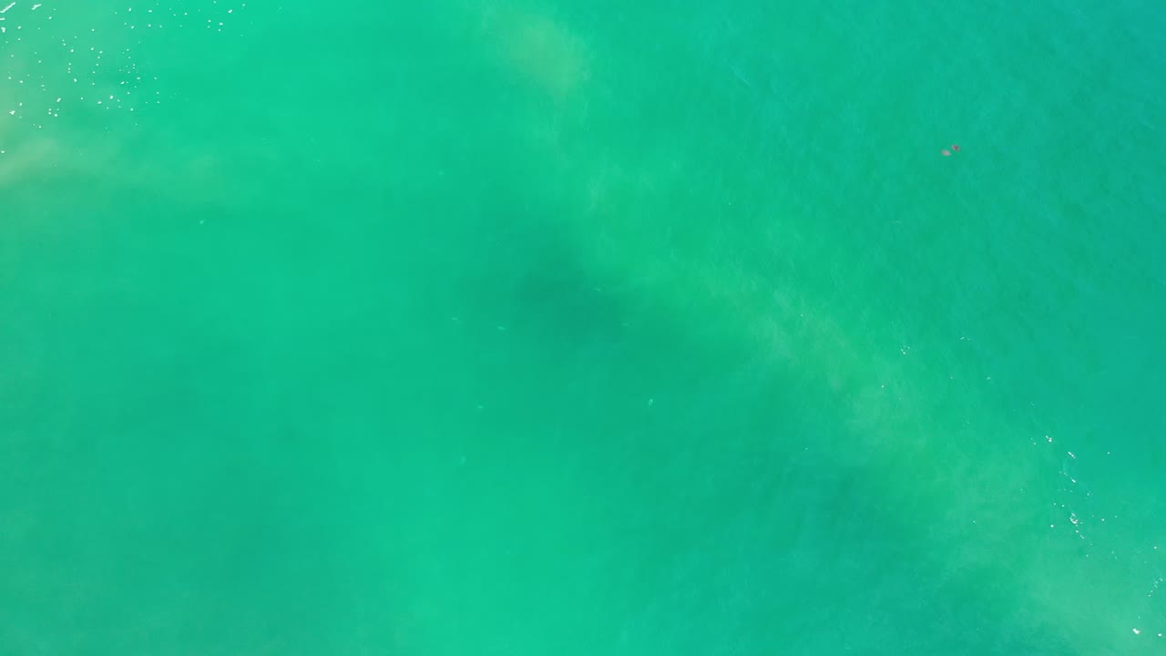 Turquoise ocean water seen from directly above.