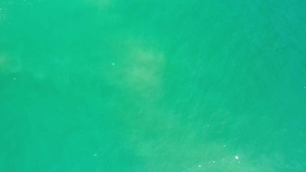 Turquoise ocean water with soft wave texture