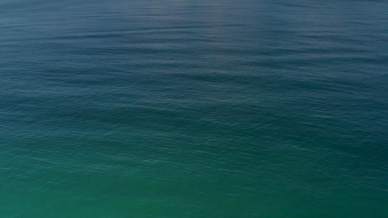 Blue green ocean surface with small ripples