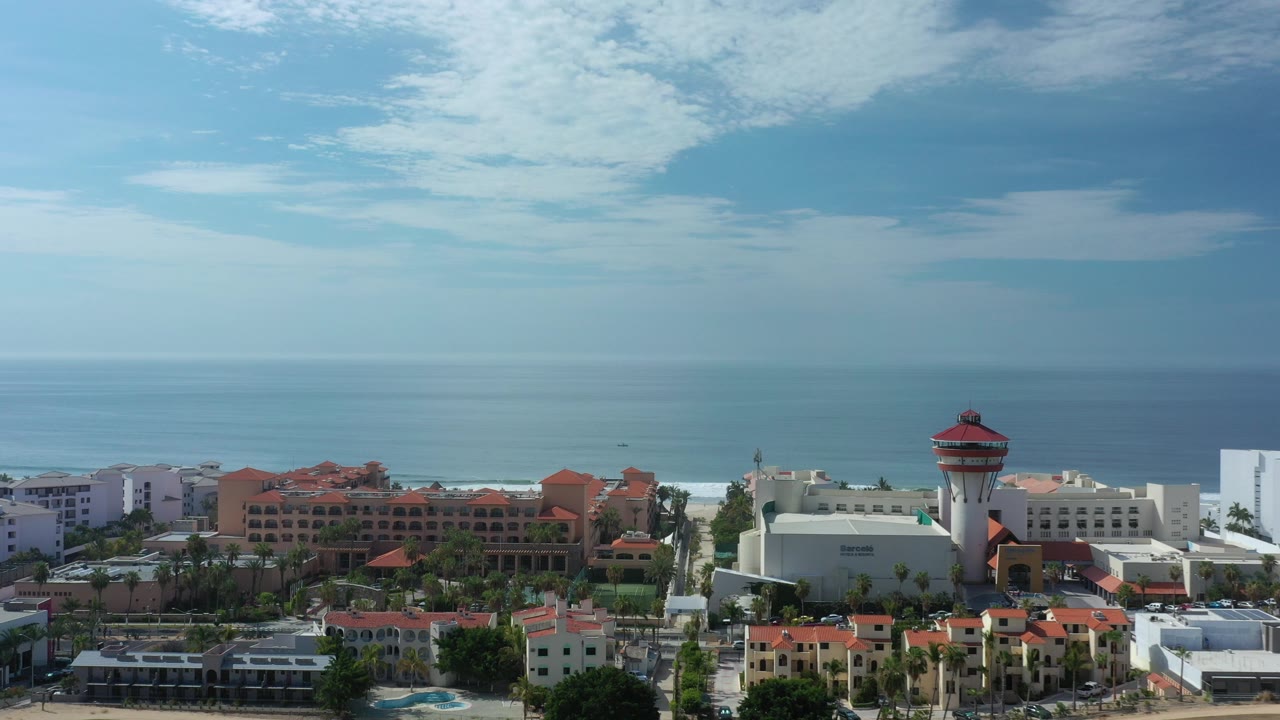 Aerial view of a beachfront resort and ocean horizon.