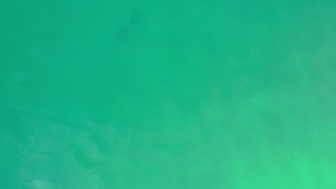 Calm turquoise sea seen straight down