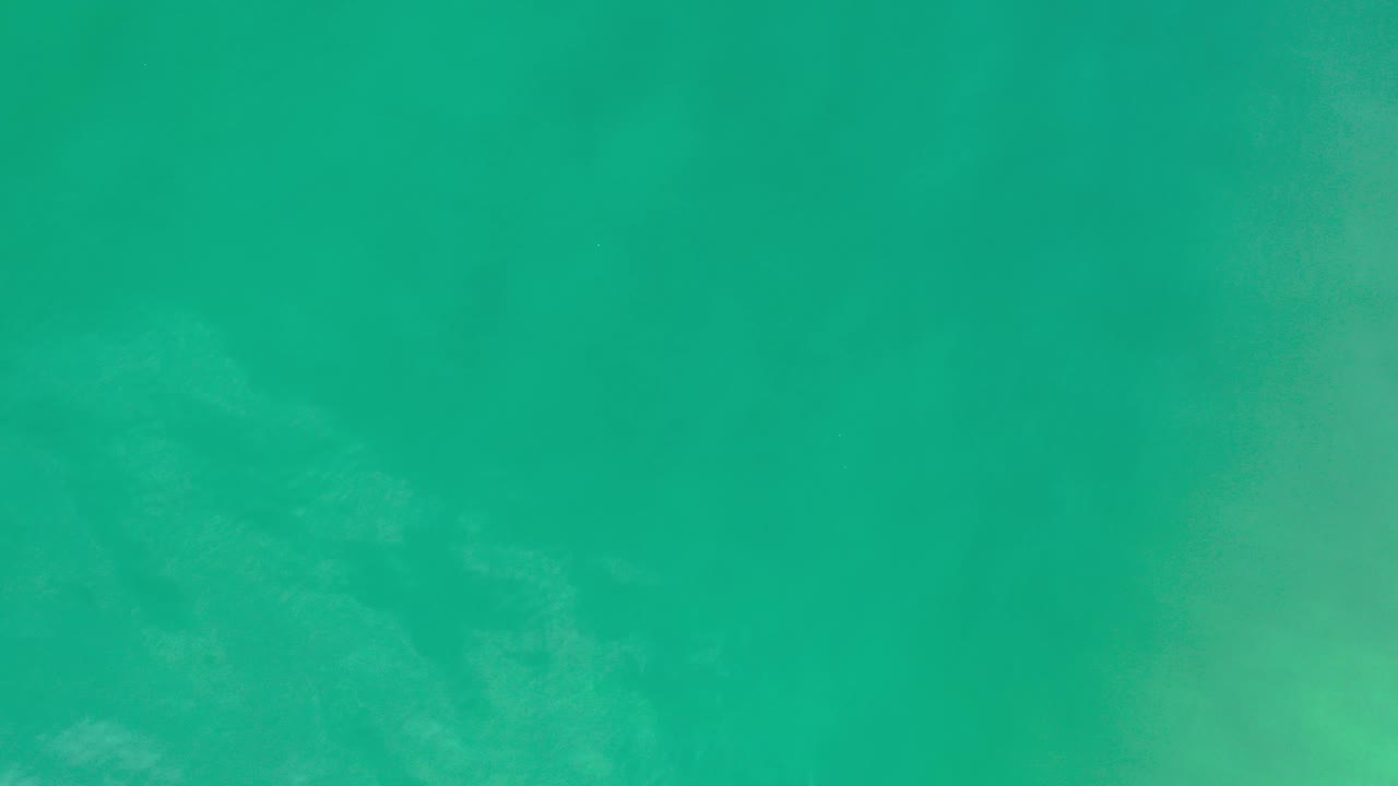 Overhead coastal water with diffuse pale patches