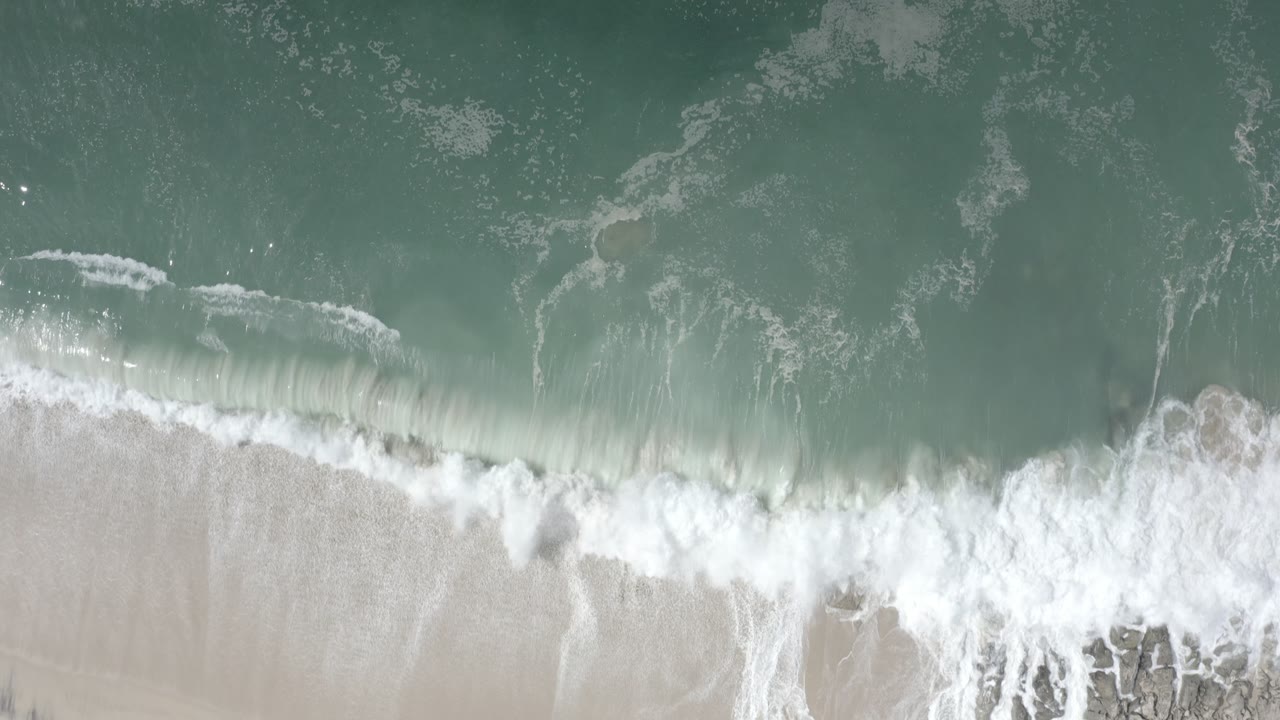 Aerial view of surf line and beach texture