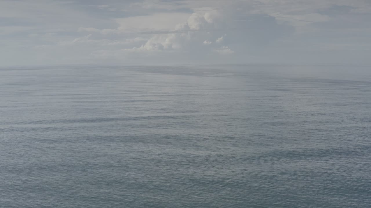 Calm sea and overcast sky with low contrast light.