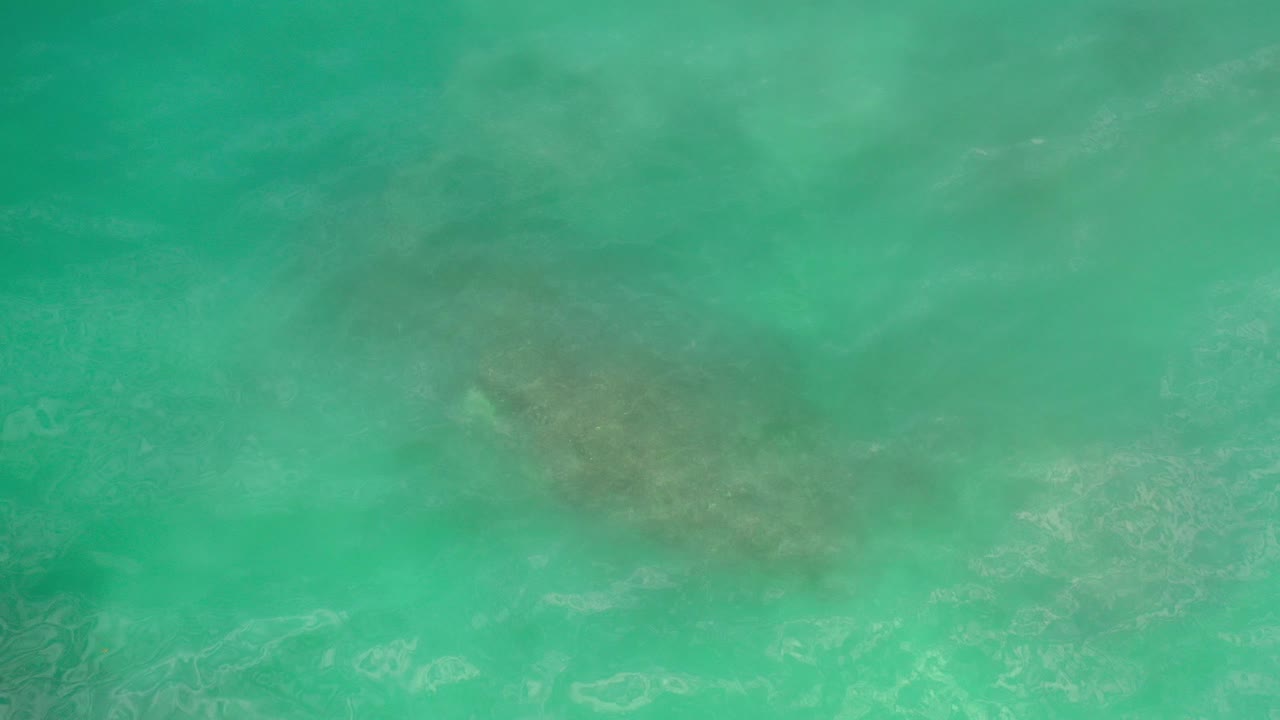 Turquoise ocean water with soft wave texture