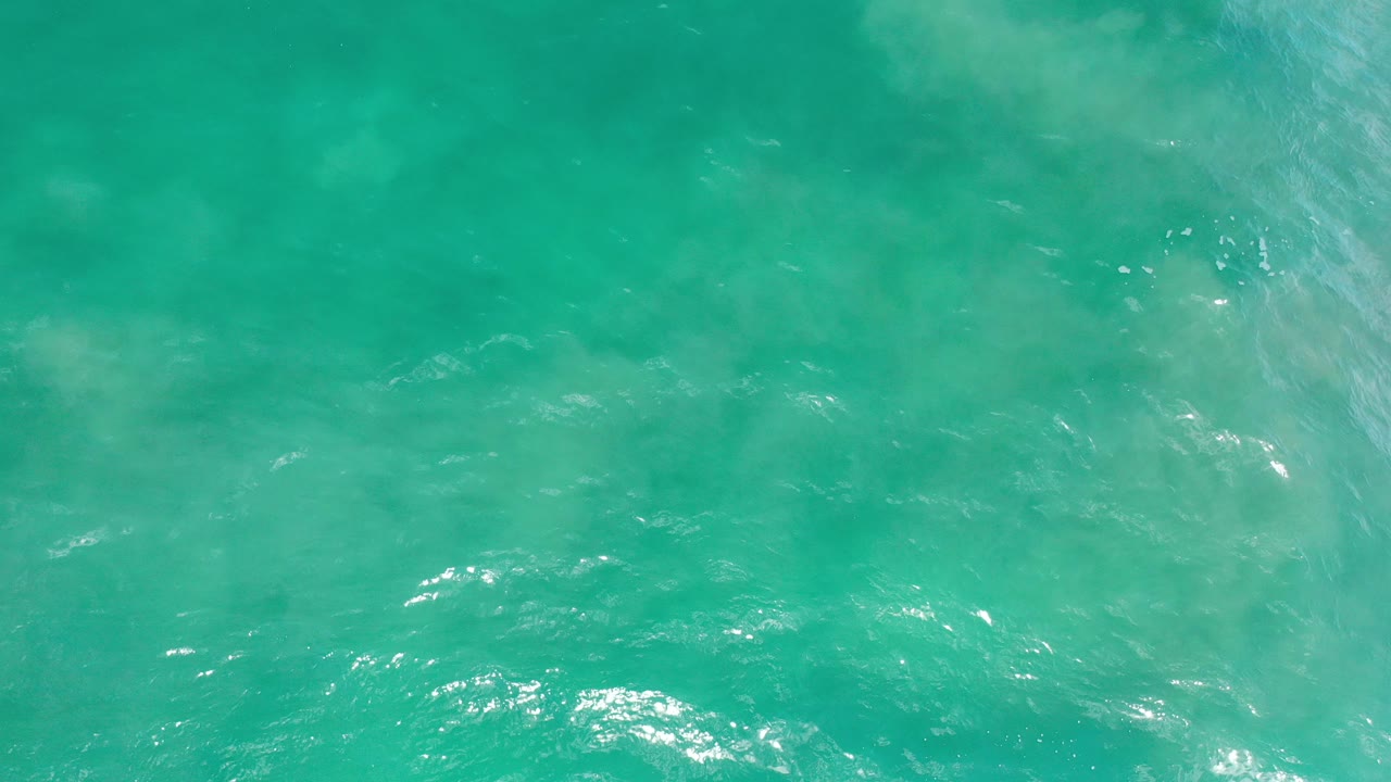 Turquoise ocean surface with soft ripples