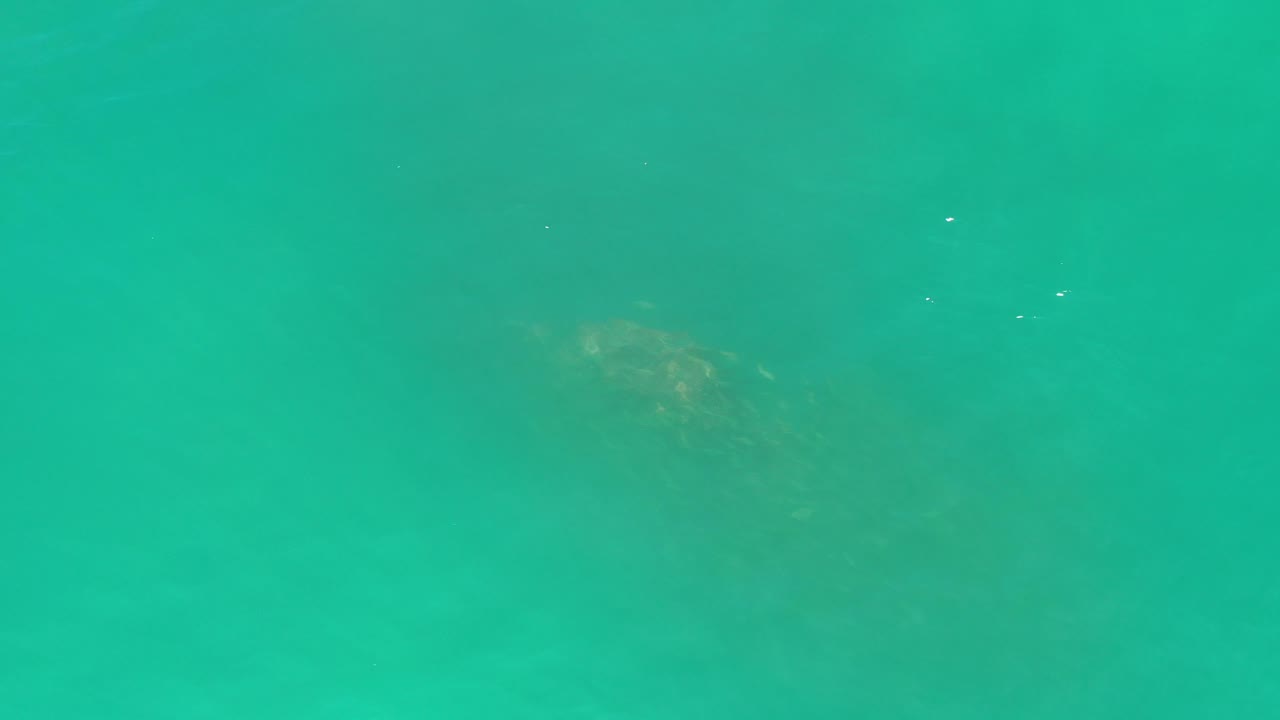 Turquoise water with soft cloudy variation beneath the surface.