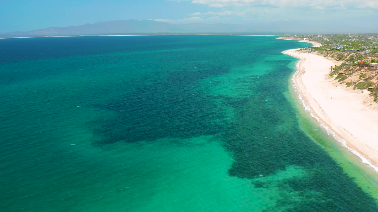 High view of turquoise sea and sandy shoreline